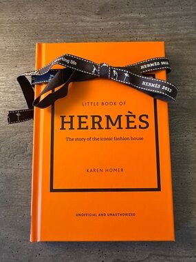 Hermès Little Book — Orange Hardcover with added Brown Ribbon.
